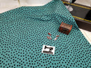Black Polka Dots on Soft Green - cotton lycra - 150cm wide - clearance