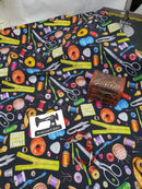 Sewing Notions on Black - cotton lycra - 150cm wide