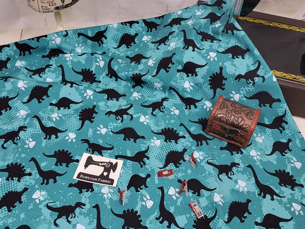 Dinosaurs - Teal - cotton lycra - 150cm wide