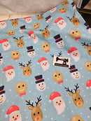 Christmas Faces Blue - cotton lycra - 150cm wide - clearance