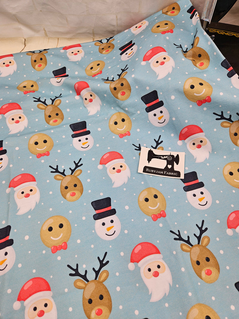 Christmas Faces Blue - cotton lycra - 150cm wide - clearance