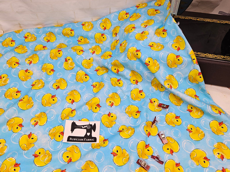 Yellow Rubber Ducks - cotton lycra - 150cm wide