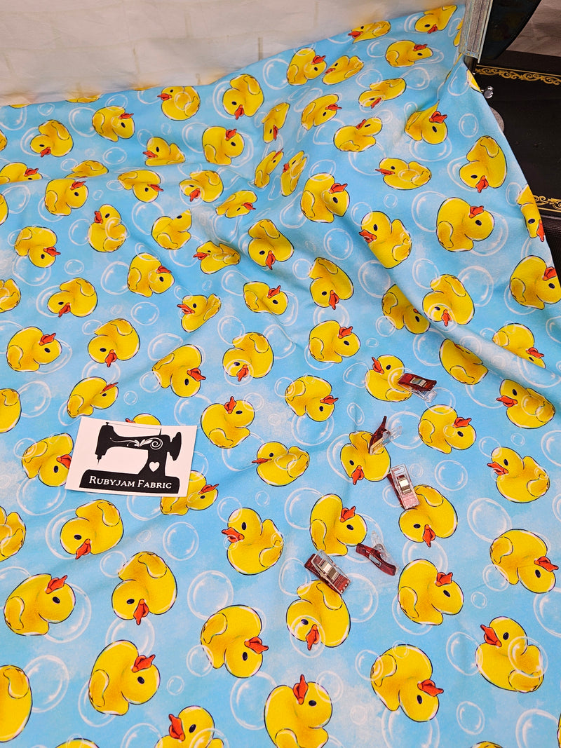 Yellow Rubber Ducks - cotton lycra - 150cm wide