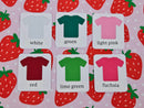 Digitally printed stretch knit fabric featuring red strawberries on pink background with white polka dots