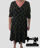 Rainbow Stars on Black - cotton lycra - 150cm wide - clearance