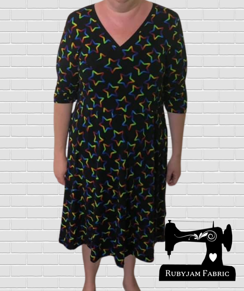 Rainbow Stars on Black - cotton lycra - 150cm wide - clearance
