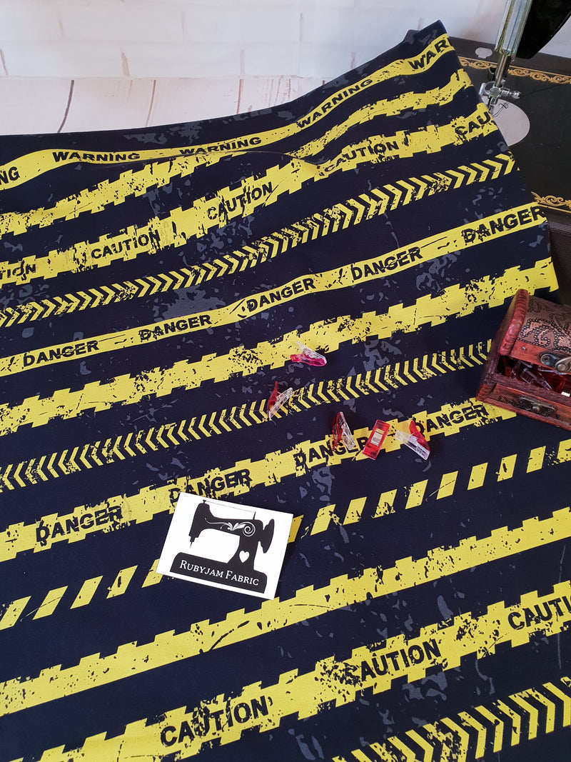 Warning Tape - cotton lycra - 150cm wide