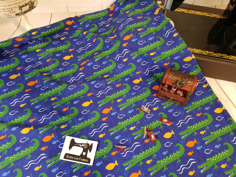 Crocodiles on Blue - cotton lycra - 150cm wide