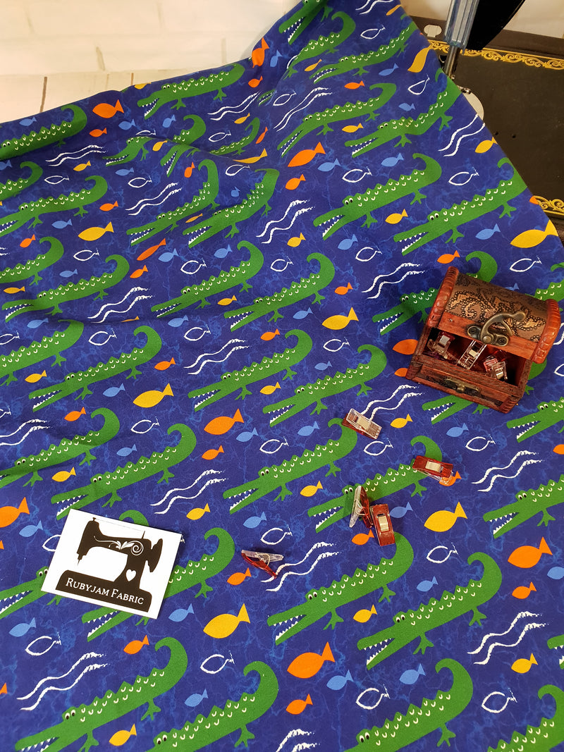 Crocodiles on Blue - cotton lycra - 150cm wide