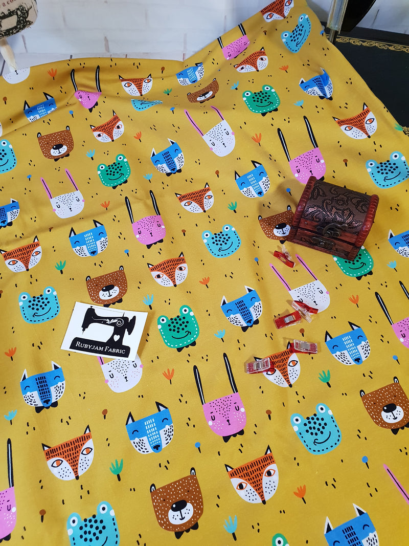 Woodland Animals on Mustard - cotton lycra - 150cm wide