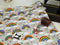 Rainbows on Grey - cotton lycra - 150cm wide