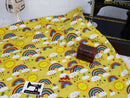 Rainbows on Yellow - cotton lycra - 150cm wide - clearance