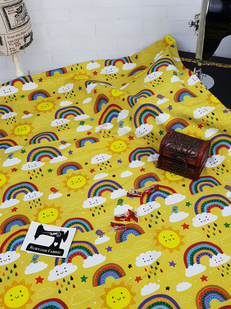 Rainbows on Yellow - cotton lycra - 150cm wide - clearance