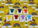 Rainbows on Yellow - cotton lycra - 150cm wide - clearance