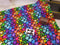 Watercolour Rainbow Hearts BLACK - cotton lycra - 150cm wide