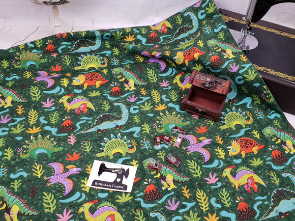 Dinosaurs on Green - cotton lycra - 150cm wide
