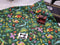 Dinosaurs on Green - cotton lycra - 150cm wide