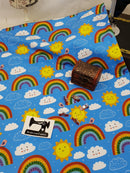 Happy Days, Rainbows on Blue - cotton lycra - 150cm wide