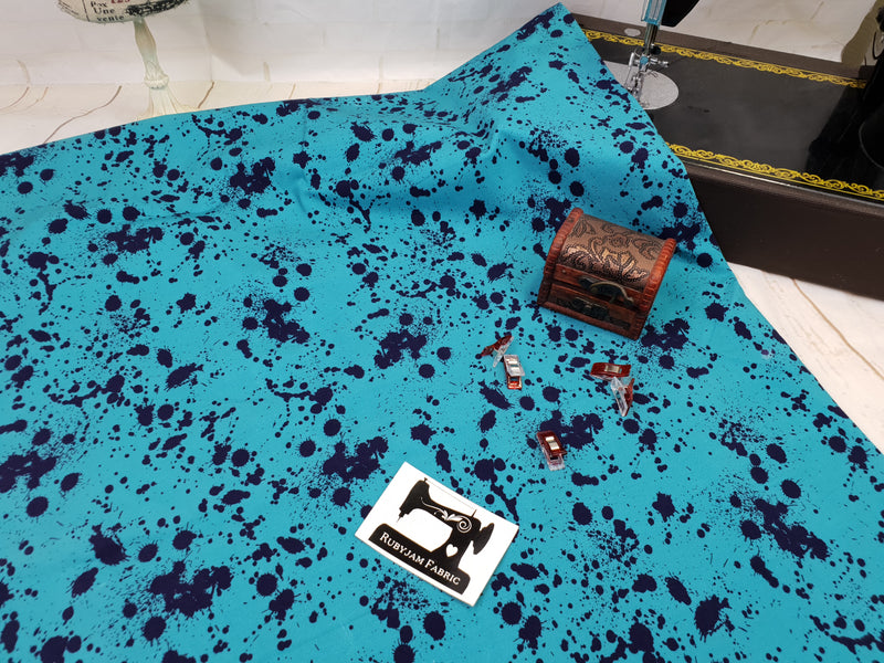 Aquamarine and Navy Paint Splatter - cotton lycra - 150cm wide