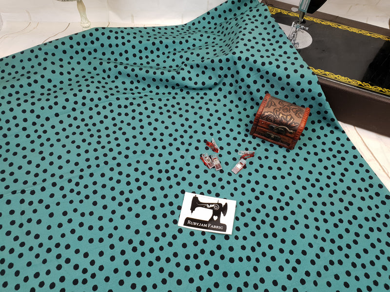 Black Polka Dots on Soft Green - cotton lycra - 150cm wide - clearance