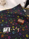 Multicoloured Stars on Black - cotton lycra - 150cm wide - clearance