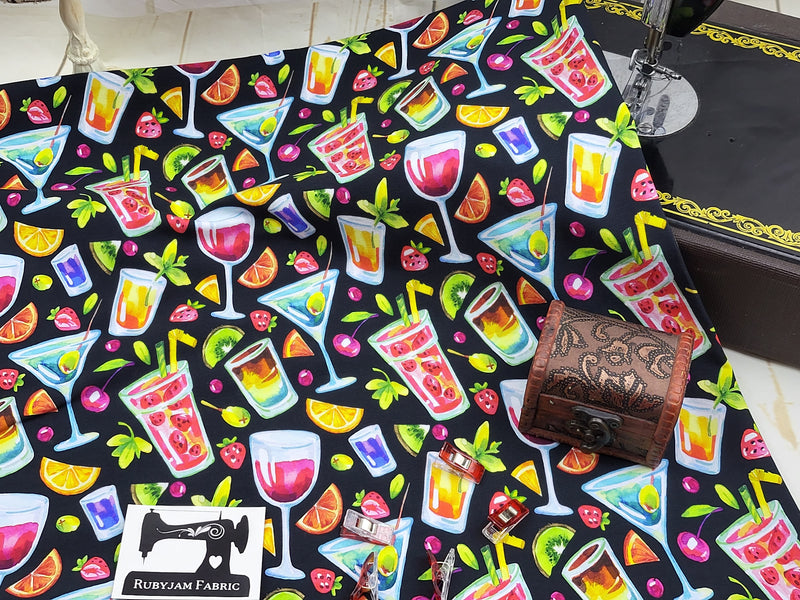 Stretch knit fabric digitally printed with bright images of cocktail drinks