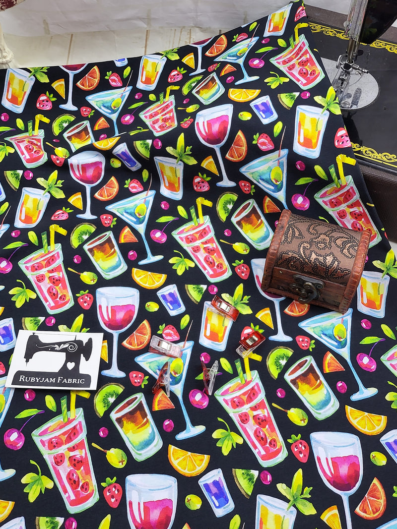 Stretch knit fabric digitally printed with bright images of cocktail drinks